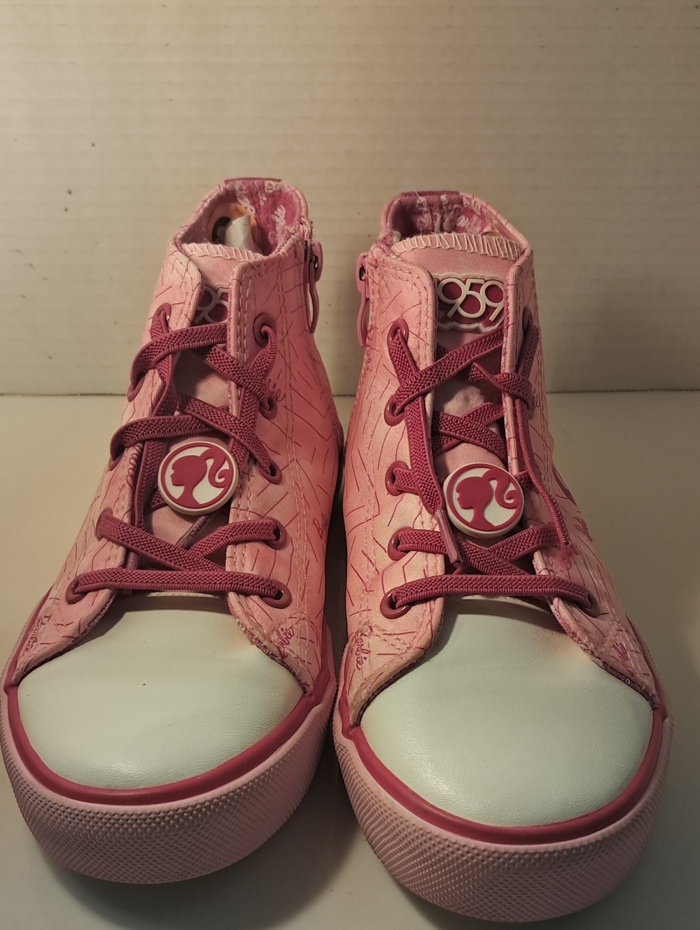 Barbie-branded high-top sneakers in pink with white toe Ground Up Barbie featuri